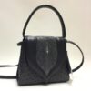 unique shoulder bag. ostrich leather. handled bag. handmade in geneva. exceptional leather goods.