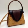 one-of-a-kind shoulder strap. brown ostrich leather. handmade in geneva.
