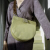 half-moon bag with patent leather and python print. plexiglass chain. perfect bag for everyday use. can hold an iPad, water bottle and more.