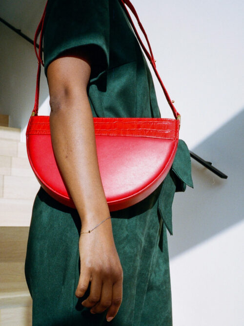half-moon bag. good quality leather. red crocodile print. chic and elegant bag.   