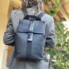 Waterproof backpack perfect for women cyclists for elegant, sporty style. Perfect for active women. Neoprene, smooth leather and black crocodile print. blue interior with plenty of storage space. handmade in geneva.